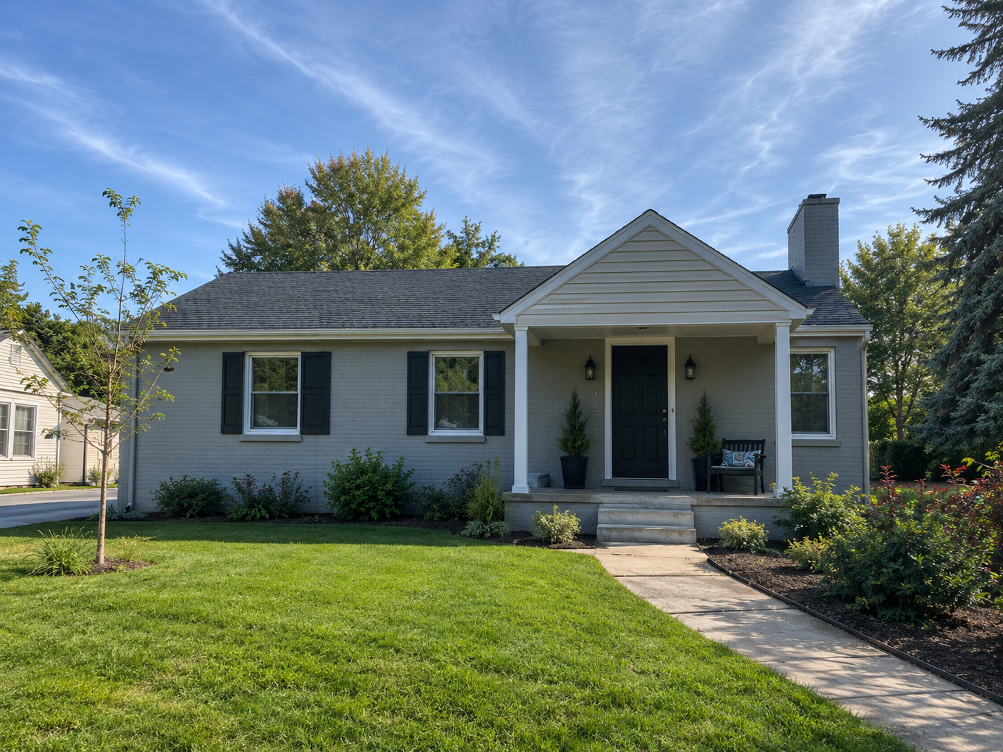 Well-kept rental home exterior with landscaped front yard